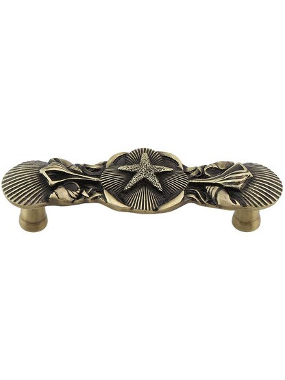 Seaside Collage Pull in Antique Brass.